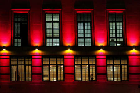 Red decorative light at old building facadeの写真素材
