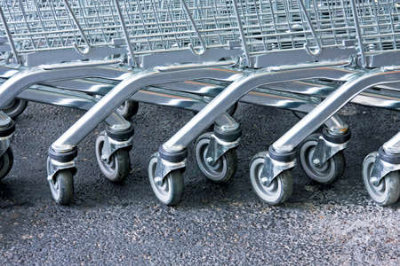 Row of supermarket karts tidy put together