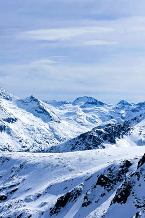 Beautiful mountain covered in snow at winterの写真素材