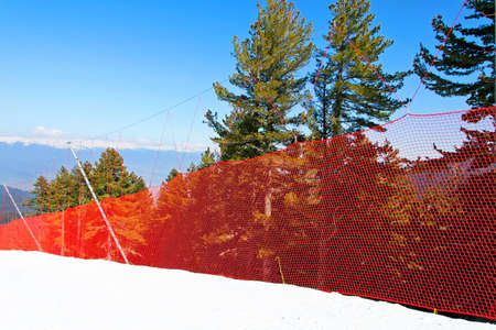 Safety net on the side of ski slopeの写真素材
