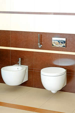 Angle shot of toilet with modern fixturesの写真素材