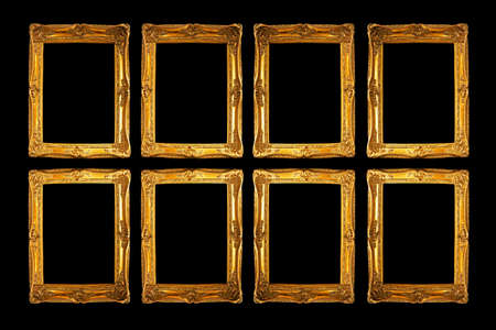 Eight frames in gold isolated on blackの写真素材