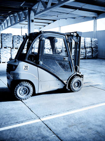 Selenium tone palette lifter in big warehouse