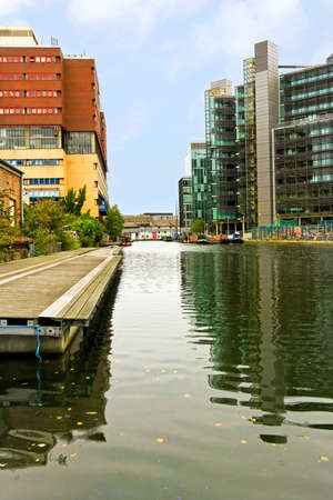 River channel with business buildings in backgroundの写真素材