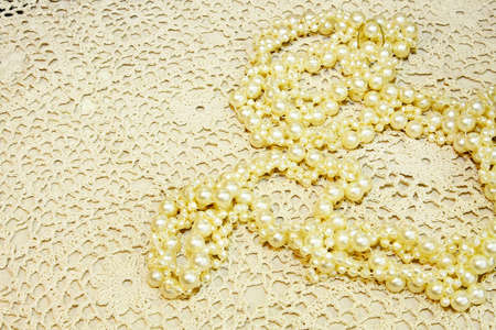Close up shot of pearls at lace