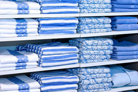 Big pile of blue towels at shelfの写真素材