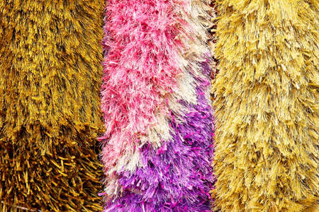 Three colorful and shaggy car wash brushesの写真素材