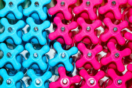 Close up shot of pink and blue pepper grindersの写真素材