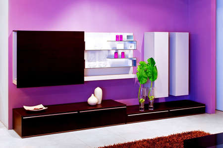 Shelf in living room with purple wallsの写真素材