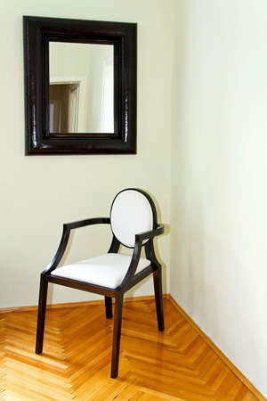 Room corner with classic chair and mirrorの写真素材
