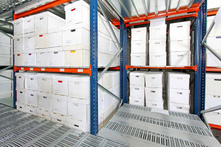 Bunch of white boxes in big storehouseの写真素材