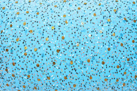 Close up shot of blue textile with pearlsの写真素材