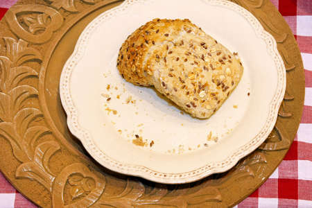 Piece of whole grain bread in plate