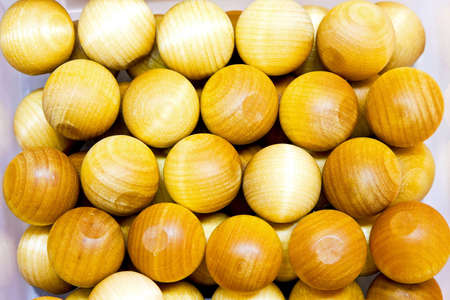 Bunch of small and yellow wooden ballsの写真素材