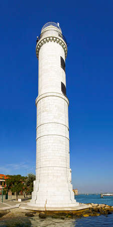 Lighthouse made of white stone on Murano islandの写真素材