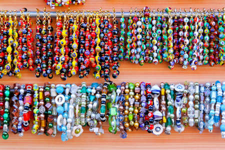 Row of necklaces and bracelets made of Murano glassの写真素材