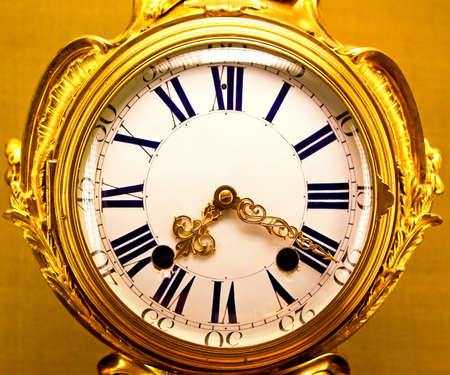 Close up shot of old golden clockの写真素材