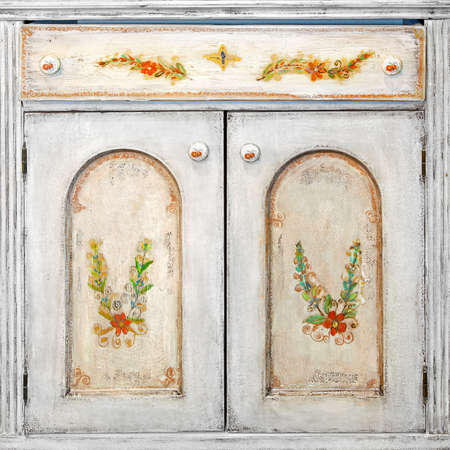 Retro grunge cabinet door with floral drawingsの写真素材