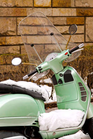 Detail of retro motorcycle covered by snowの写真素材