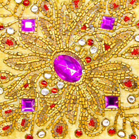 Detail of sparkling jewels with gold ornamentsの写真素材