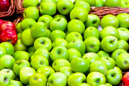 Bunch of organic fresh apples on a marketの写真素材