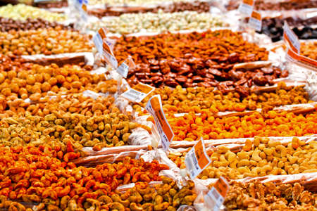 Big assortment of salty snacks on market stallの写真素材