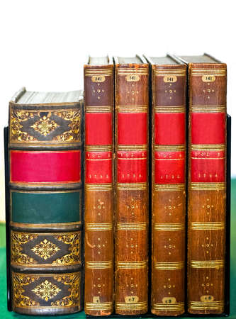 Very old medieval books at library shelfの写真素材