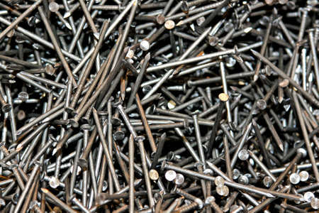 Background of unused metal nails mixed together