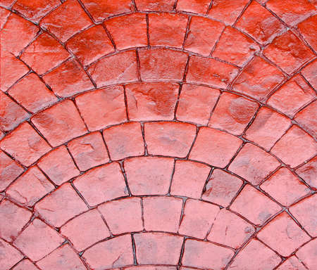 Detail of shiny road made of red cobbleの写真素材