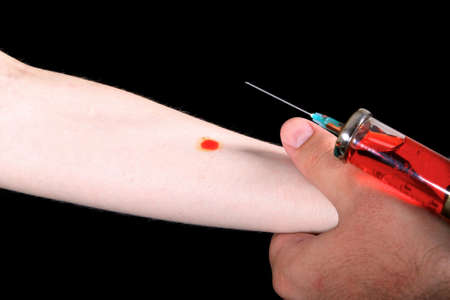 Detail of human hand getting an injectionの写真素材