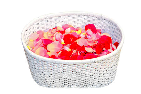 Rattan basket with rose petals and clipping path の写真素材