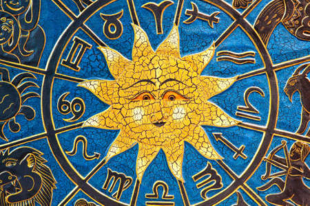 Zodiac signs in circle with golden sun の写真素材