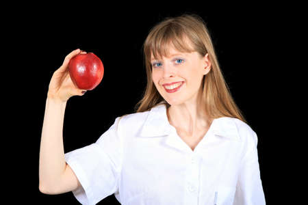 Young medical professional holding red apple in handの写真素材