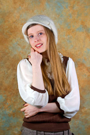 Young blonde teenage girl with white wool hat の写真素材