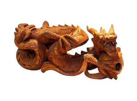 Wooden carved dragon figurine isolated の写真素材