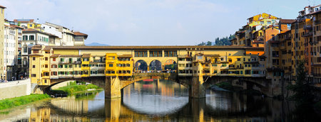 FLORENCE, ITALY - SEPTEMBER 28: Ponte Vecchio bridge on SEPTEMBER 28, 2009. Old Ponte Vecchio bridge at river Arno in Florence at sunny day. The historic centre of Florence is a World Heritage Site by UNESCO. のeditorial素材