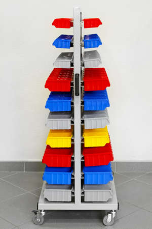Cart with colorful plastic shelves for workshop の写真素材