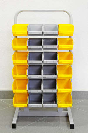 Rack with plastic boxes for parts storage の写真素材