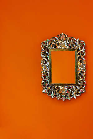 Oriental style portrait frame at orange wall の写真素材