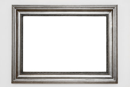 Silver photo frame isolated at white wallの写真素材