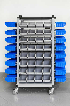 Trolley with plastic shelves for garage shop の写真素材