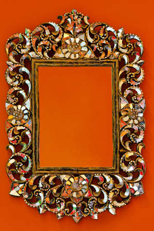 Oriental style portrait frame at orange wall の写真素材