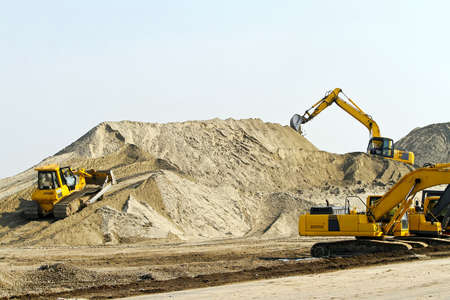 Heavy machinery equipment at road construction site 