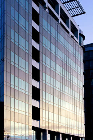 Modern business building with blue glass facade 