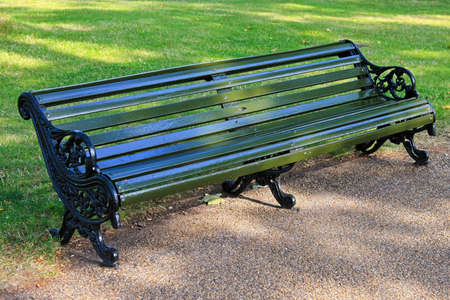 Old green bench in Hyde park London
