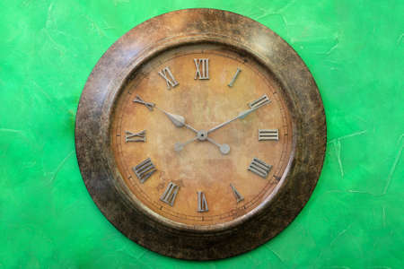 Vintage style analogue clock with roman numbersの写真素材