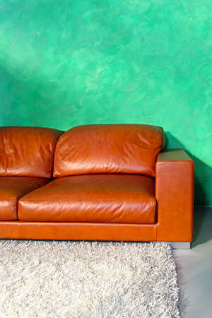 Part of brown leather sofa in living roomの写真素材