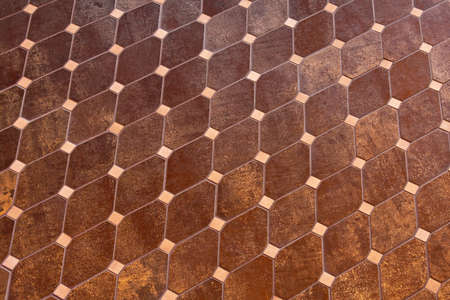 Repetitive pattern of brown marble hard floor