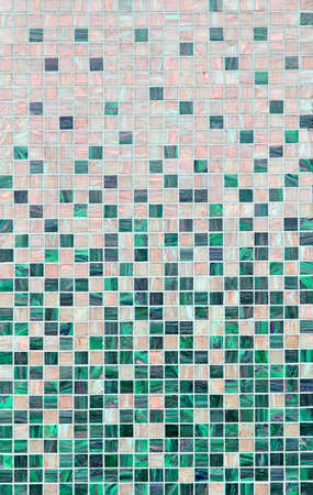 Small square mosaic style tiles at wall