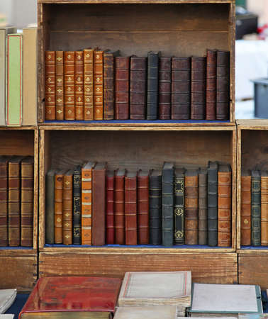 Retro style books in old bookcaseの写真素材